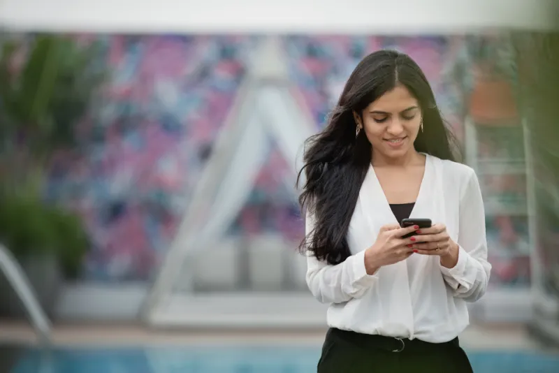 Woman completing an online GLP-1 health assessment on her phone